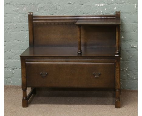 An oak telephone table with drawer to the base.