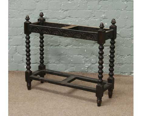 An oak hall stand with bobbin turned supports