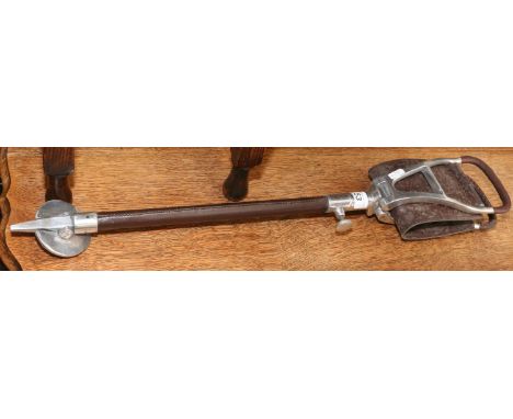 A leather mounted shooting stick.