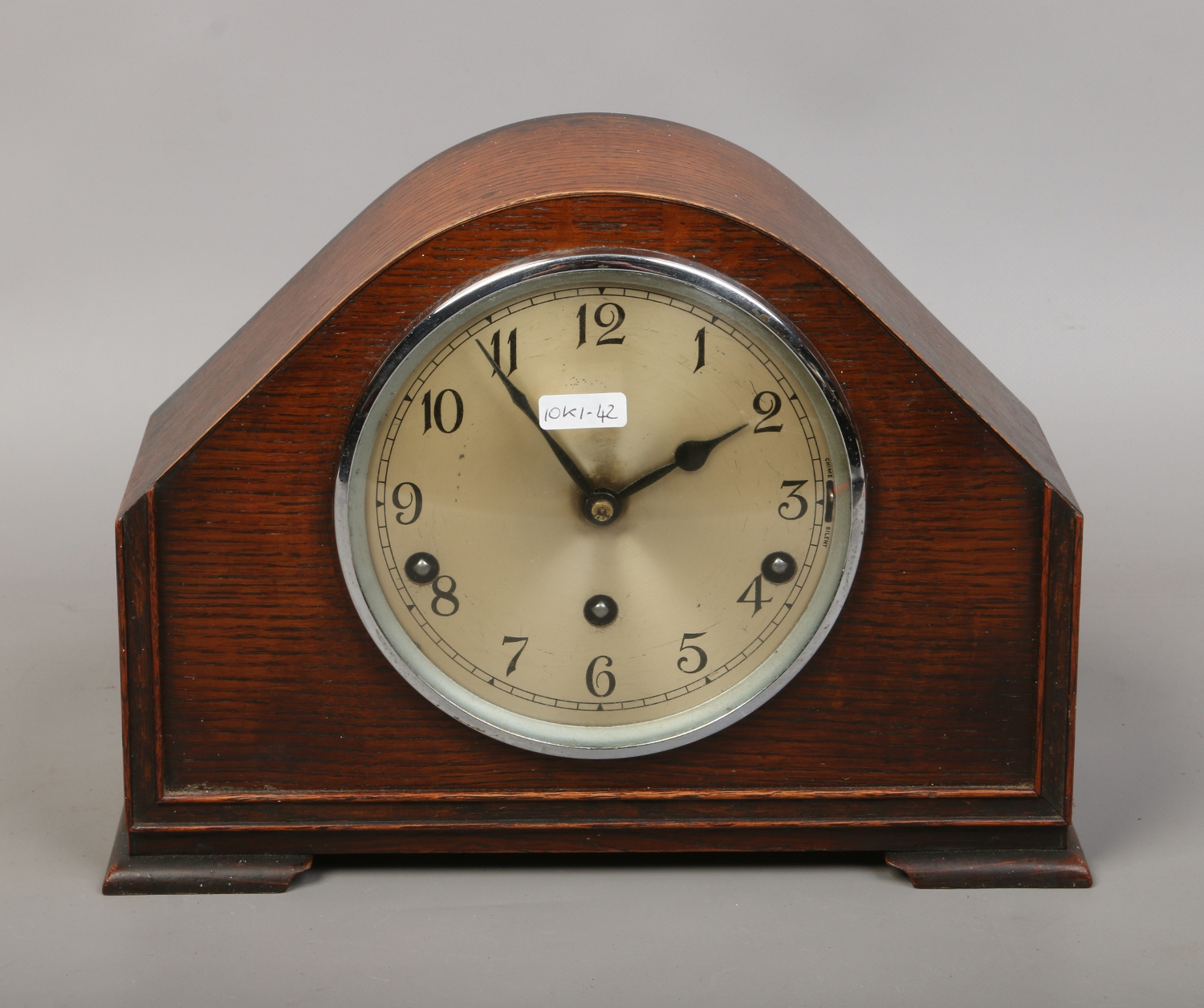 An oak cased Westminster chime mantel clock with key and pendulum by
