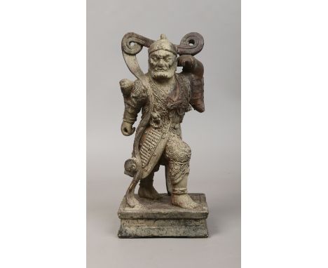 A Chinese carved wood small statue of warrior with gesso decoration.