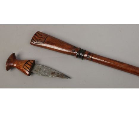 An Indian carved walking stick with concealed dagger.