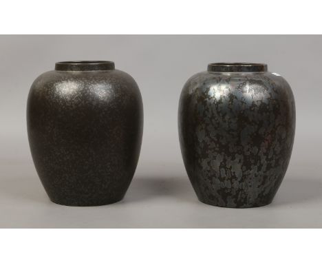 Two Poole pottery vases.