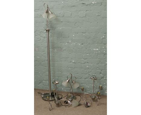 A quantity of modern brushed chrome effect lighting including a standard lamp, ceiling light etc all with opaque glass shades