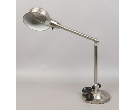 A adjustable brushed chrome reading lamp.