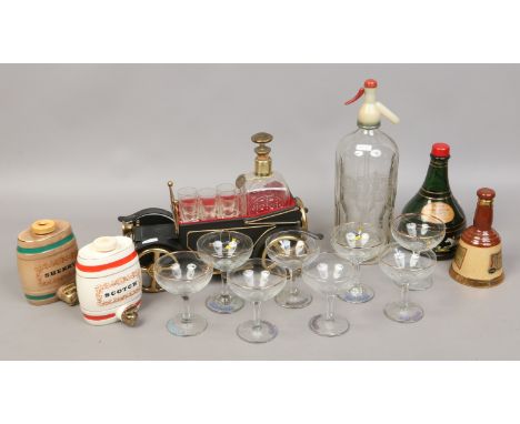 A novelty musical decanter and glass et, along with Wade decanters, E.Holmes & Son soda syphon, Babycham glasses etc. 