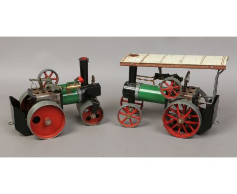 A vintage manual steam roller and a traction engine
