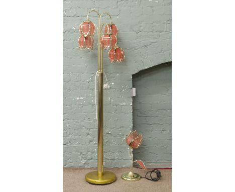 A brass five branch standard lamp with floral shaped shades along with a matching tablelamp.