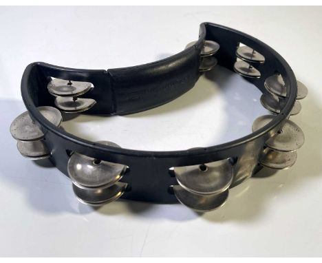 A 'RhythmTech' handheld tambourine, used onstage by Liam Gallagher during Oasis concerts c late 2000s. Obtained in person by 