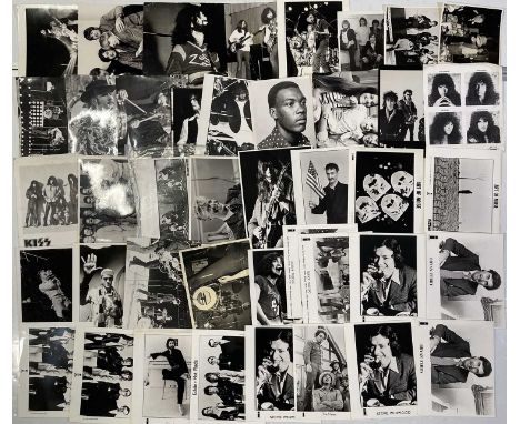 56 assorted variously sized, though mostly 8x10", press and promotional photographs with artists to inc Kiss, Led Zeppelin, R