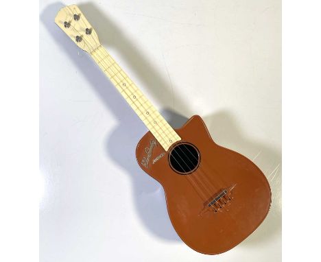 A 1957 Selcol 'Junior' Elvis guitar, approx 29" long. Some scuffs and wear to body. 