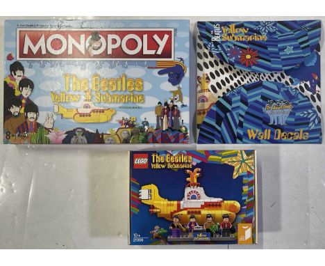 Beatles collectables to inc: Yellow Submarine Monopoly game, a boxed Lego Yellow Submarine set 21306, a set of wall decals.