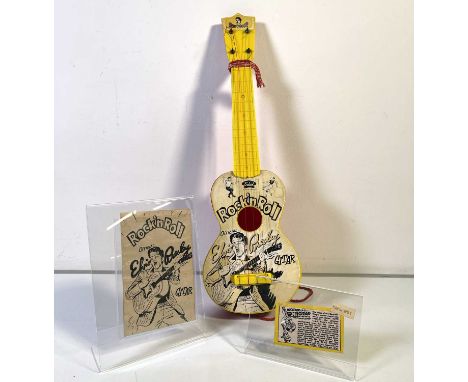 A rarely seen original c 1950s Elvis Presley 'Gitar' by Selcol. Measures approx 21". Shows some wear and evidence of glued re