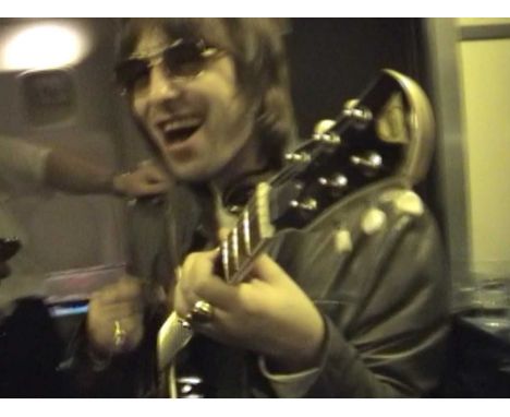 A Pignose self-amplifying guitar (with original softcase) - sold with video footage (on a USB) of Liam Gallagher playing this