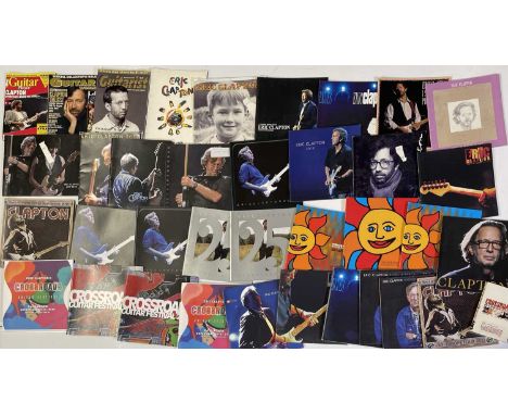 33 assorted Eric Clapton concert and tour programmes c 1980s-00s. Also a small selection of ticket stubs, magazines, books et