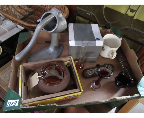 A box of sundries to include, ashtray, commemorative mug, orange squeezer etc