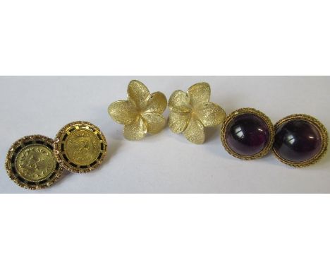 A pair of 14k flower head earrings, weight 7g, together with a pairs of earrings set amethyst cabochons and another pair