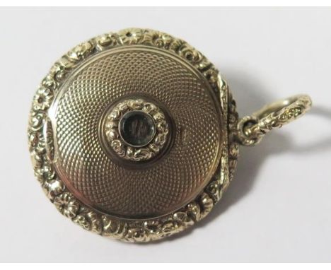 A Victorian High Carat Gold Locket set with ruby and pearls, 12.2g, 29mm diam.