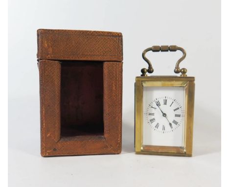 A Small French Brass French Brass Carriage Clock in original leather carrying case, 8.5cm to top of handle, running