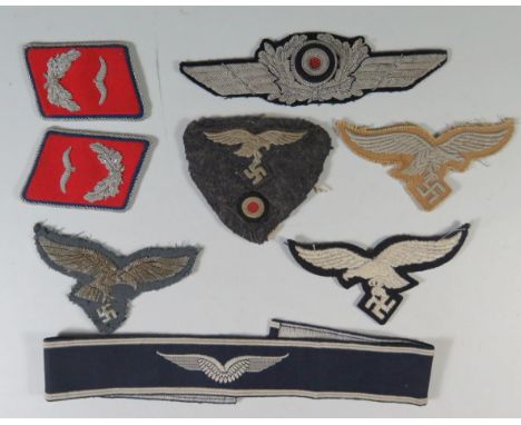 A Collection of WWII German Luftwaffe Cloth Badges: pair of collar tabs, 2 x breast eagle, cockade, cap insignia ordinary ran