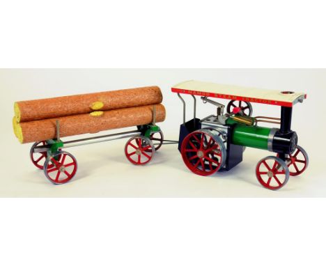 A MAMOD LIVE STEAM TRACTION ENGINE AND TIMBER WAGON