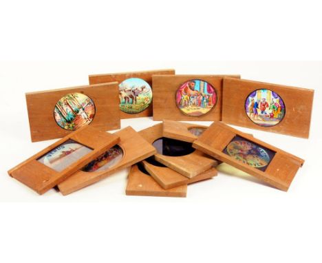 ELEVEN VICTORIAN MAGIC LANTERN SLIDES IN MAHOGANY MOUNTS, ALL COLOURED, VARIOUS SUBJECTS, INCLUDING COMIC, VENUS AND MARS