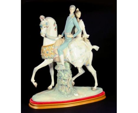 A LLADRO GROUP OF A COUPLE ON HORSEBACK 