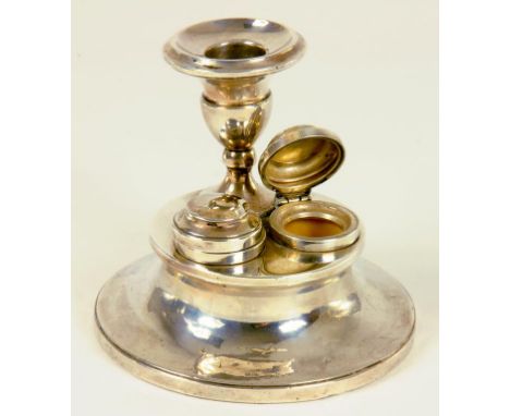 AN UNUSUAL GEORGE V SILVER DESK CANDLESTICK OF CAPSTAN FORM, THE BASE SET WITH TWO LIDDED INKWELLS, BIRMINGHAM 1913, LOADED