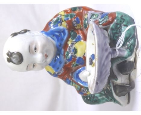 Chinese ceramic figure holding bowl H: 13 cm 