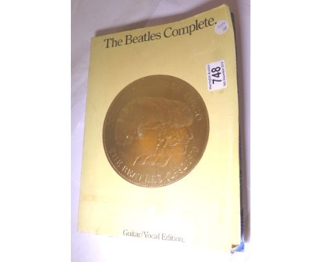 Beatles complete song book plus three 45 rpm records and photostat copy of Beatles first Hamburg contract