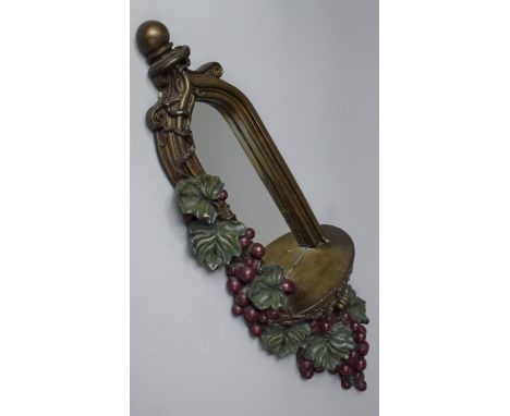 A Modern Resin Wall hanging Mirrored Sconce in the Form of a Classical Arch Draped  with Vines and Grapes, 72cm high 