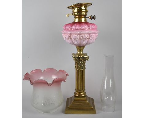 A Late Victorian Brass Corinthian Column Oil Lamp with Cranberry Coloured Reservoir and Cranberry Edged Acid Etched Shade, Sq
