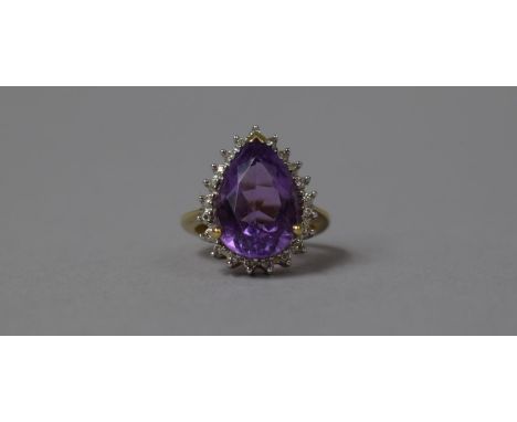 A 9ct Gold Mounted Ladies Dress Ring with Large Pear Cut Amethyst Stone Surround by Diamond Chips, Size J 