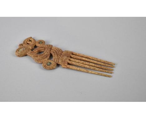 A Maori Souvenir Whale Bone Comb with Abalone Shell Mounts, 19cm Long 