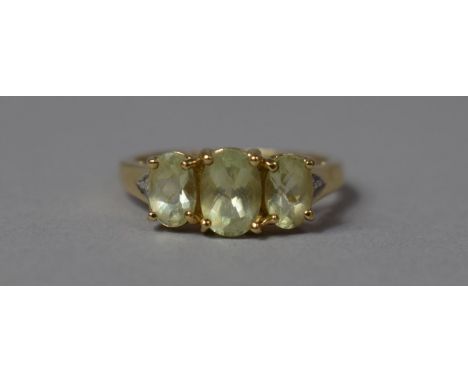 A 9ct Gold Dress Ring with Three Peridot Stones and Diamond Chips, Size N 