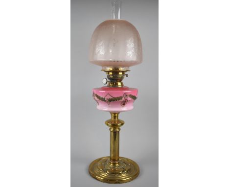 An Art Nouveau Brass Based Oil Lamp with Painted Cranberry Ceramic Reservoir and Etched Shade, Duplex Controls, Overall Heigh