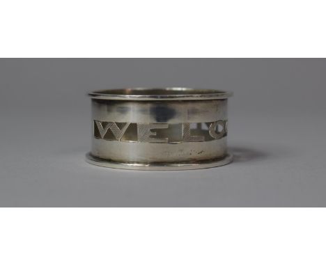 A Silver Napkin Ring with Pierced Band, Inscribed 'Welcome' 