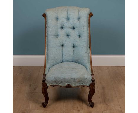 A Victorian rosewood nursing chair, with button upholstered back, blue upholstery and scrolling front legs91cm wide x 94cm hi