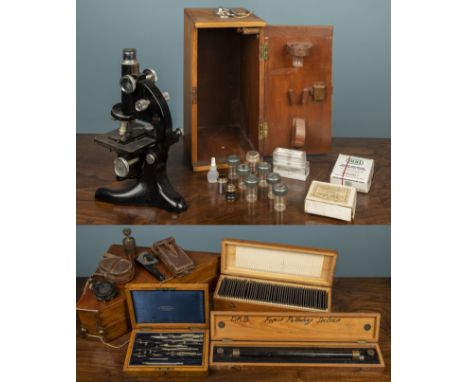A Model 29 Beck Ltd microscope, possibly Army use; together with a World War II military compass by TG & Co Ltd, in a leather