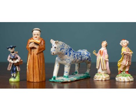 A Royal Worcester porcelain candle snuffer, modeled as a standing monk, together with three further porcelain figurines and a