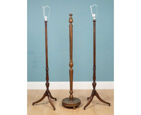 A carved and painted gilt wooden standing floor lamp on a circular base, 154cm high x 33cm diameter, together with a pair of 