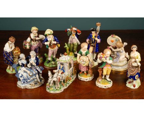 An assortment of ceramic figures, comprising of a Meissen porcelain figure of a cherub, marked with a blue cross to the base 