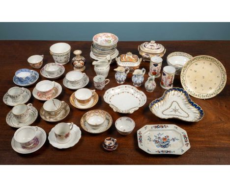A collection of 18th century and later porcelain; New Hall; Derby; etc. To include cups and saucers; sugar boxes and covers; 