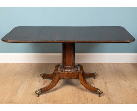 A 19th century and later sofa table with a rectangular top and reeded edge on a conforming support with splaying legs termina