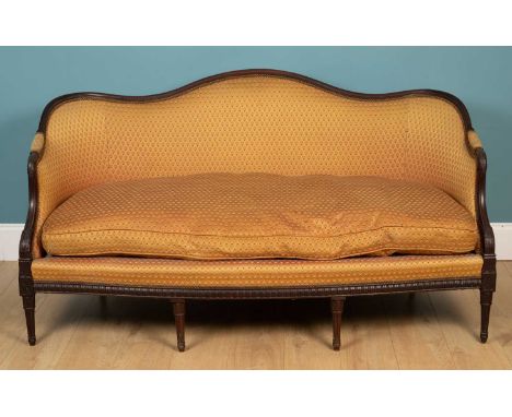 A French-style carved hardwood framed sofa with bowed front and turned fluted legs166cm wide x 80cm deep x 90cm highMinor mar
