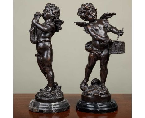 A pair of bronze figures of cherubs playing instruments, one indistinctly signed 'L.F.M....', mounted on turned marble socles