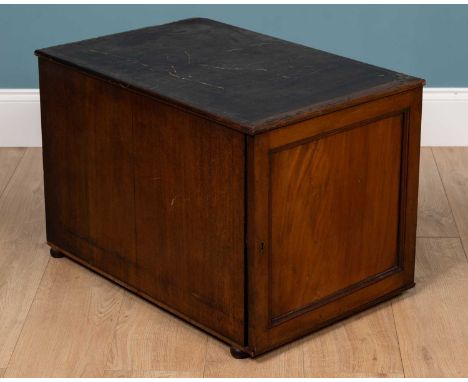 A 19th century part collectors cabinet, with a panel door to the front with sliding trays within48cm wide x 72cm deep x 50cm 