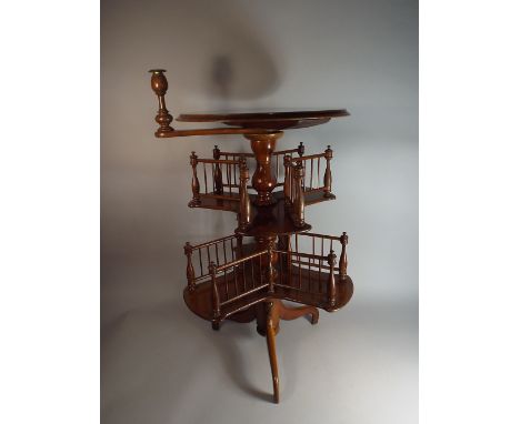 A Mahogany and Walnut Two Tier Revolving Bookcase Table with Pivoted Candlestick, 77 cm High 