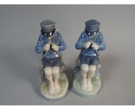 A Pair of Royal Copenhagen Figures of Seated Boy Whittling Stick, Number 905