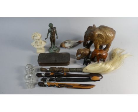 A Collection of Curios to Include Souvenir Fly Whisps, Letter Openers and Spoons, Carved Elephants, Classical Bronze Effect F